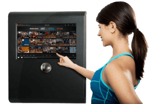 Woman Selecting Workout Program from Fitness on Demand